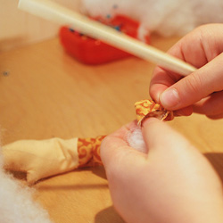 Use chopstick or pencil to stuff arm.