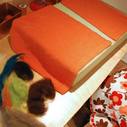 Lay the squares on the your felting mat.