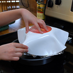 Shape the record into a bowl.